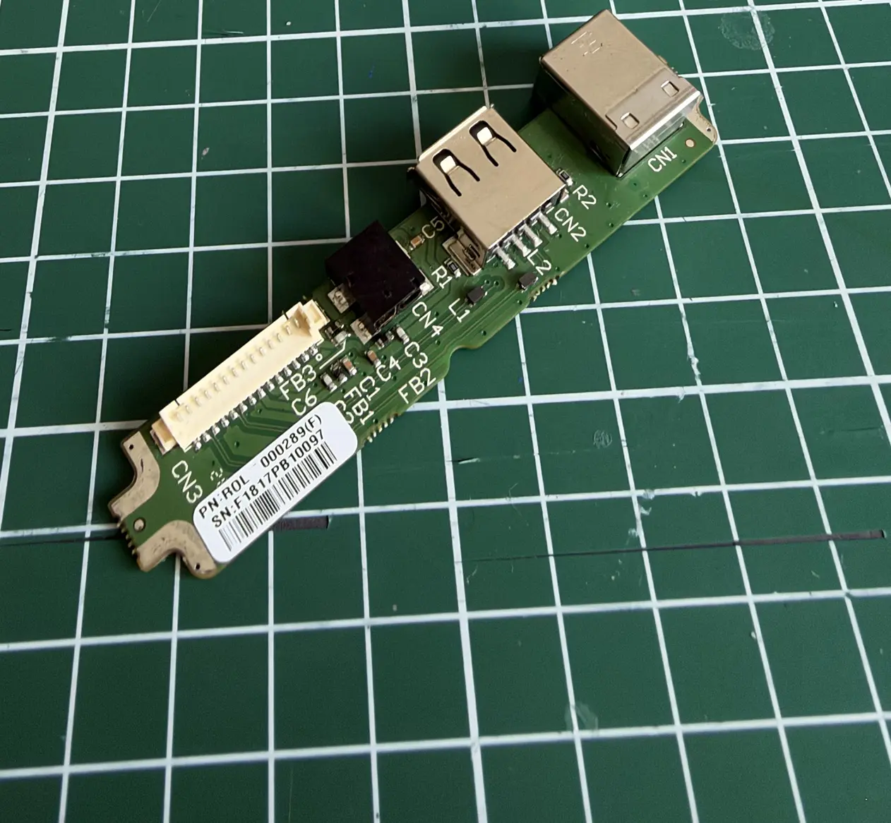 The RISE ports board ROL-000289 out of the case: USB-B jack, USB-A jack, DC jack and the white 14-pin CN3 connector