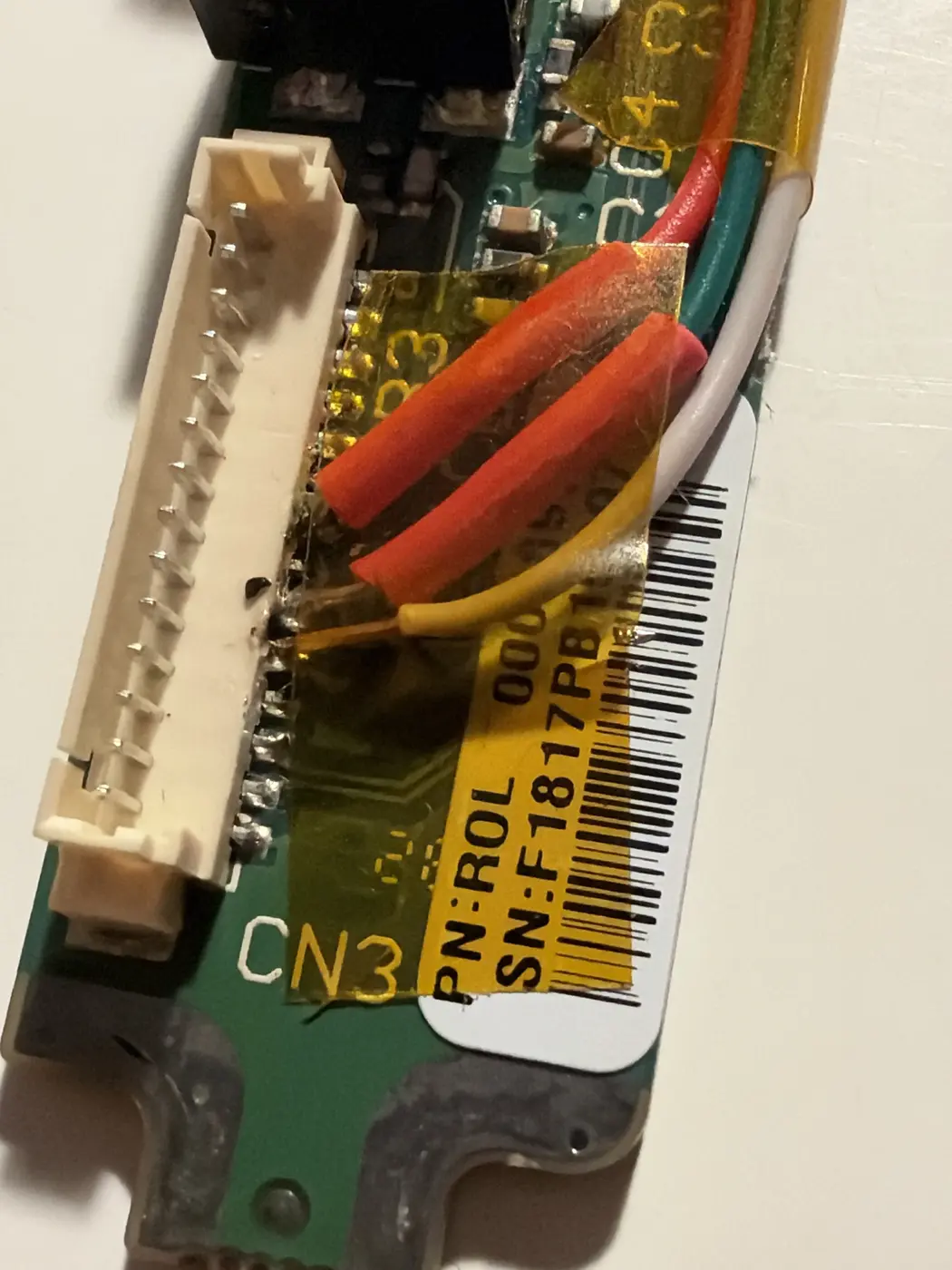 Top side of the ports board: wires landing on CN3 legs, Kapton over the neighbouring pins